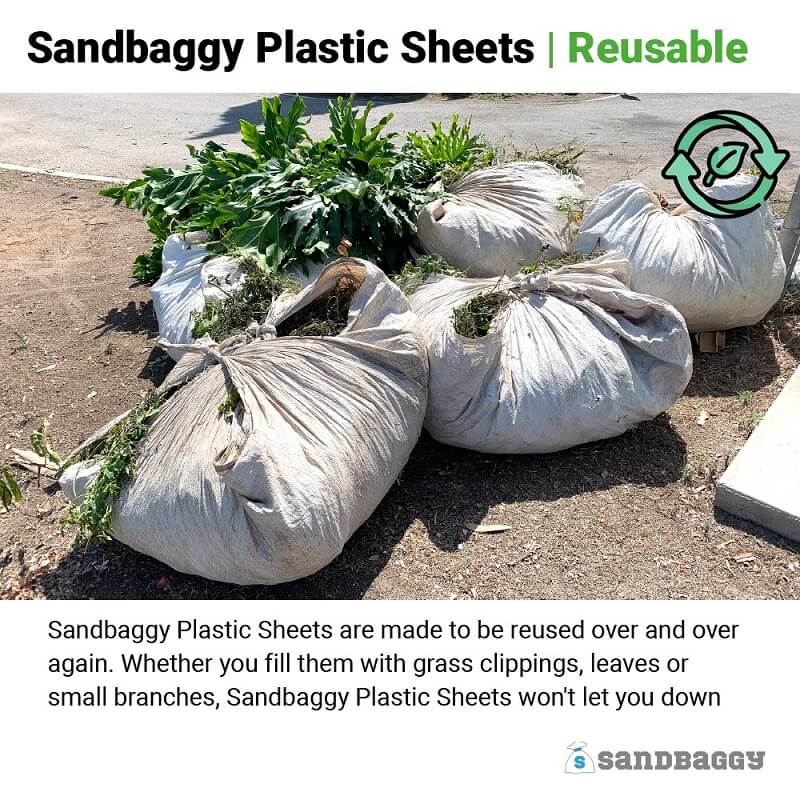 Reusable Garden Plastic Sheets tied up into bags for storage and disposal of grass, branches, and twigs.