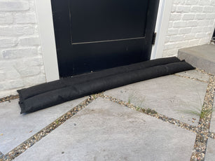 water activated tube sandbags protecting home
