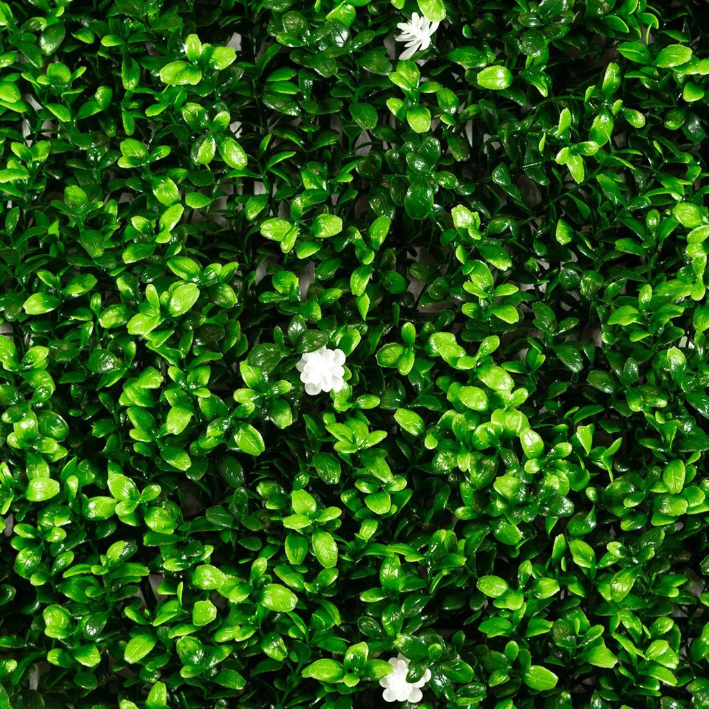 artificial greenery wall panel with white flowers