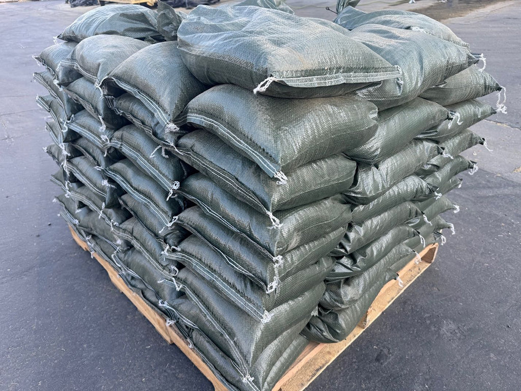 green pre filled sandbags stacked