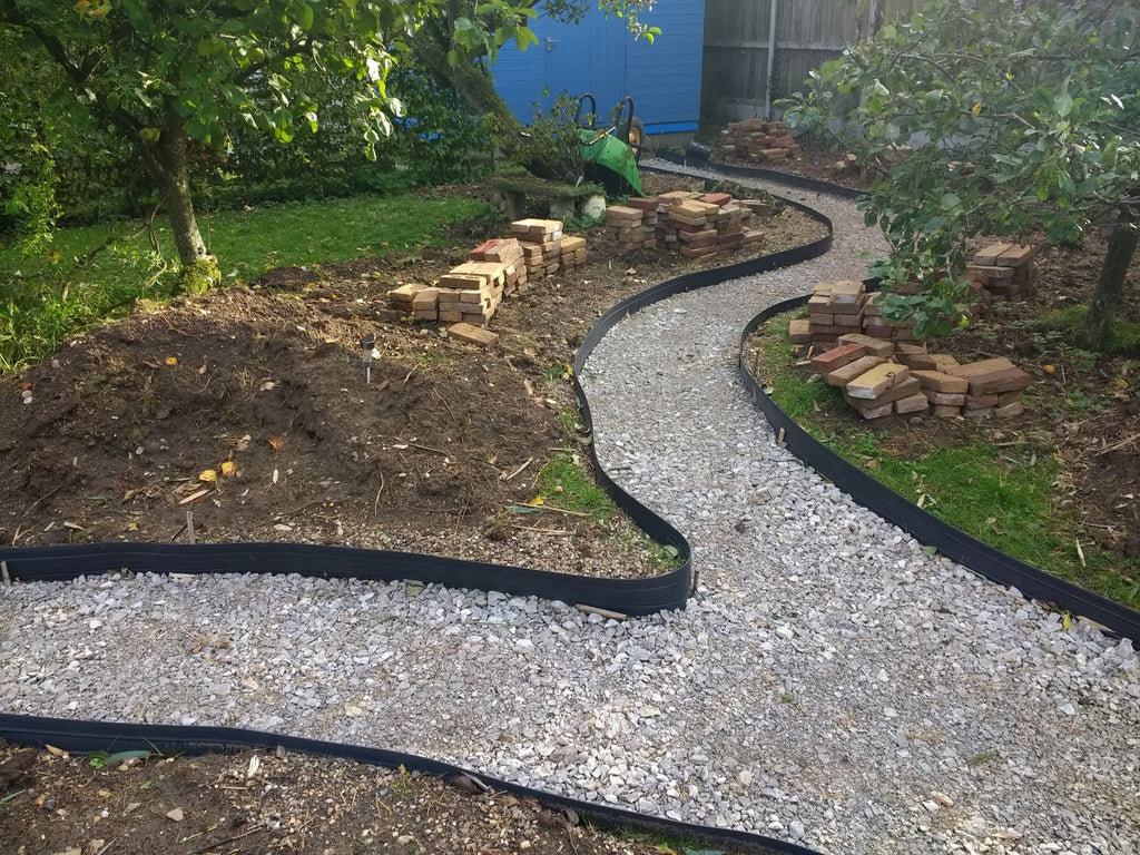 timber spikes for plastic garden edging installation