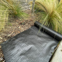 18 inch wide landscape fabric roll on top of soil