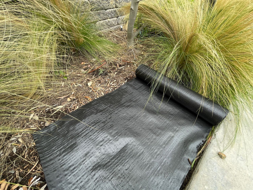 18 inch wide landscape fabric roll on top of soil