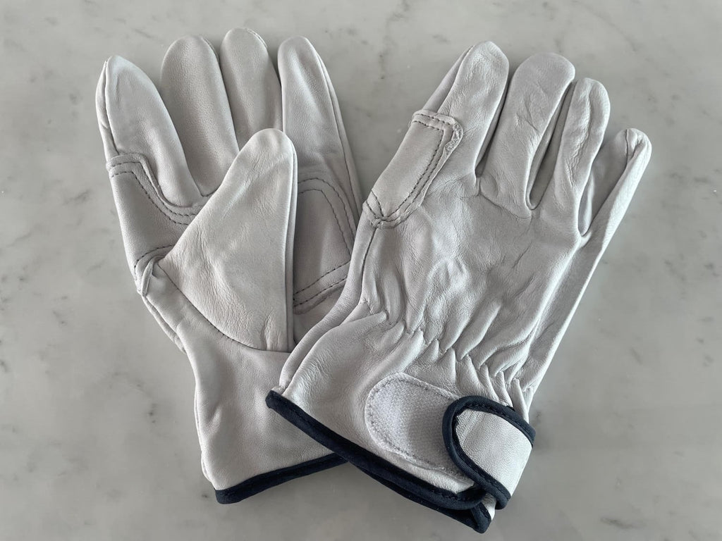 pair of small / medium sized leather safety work gloves