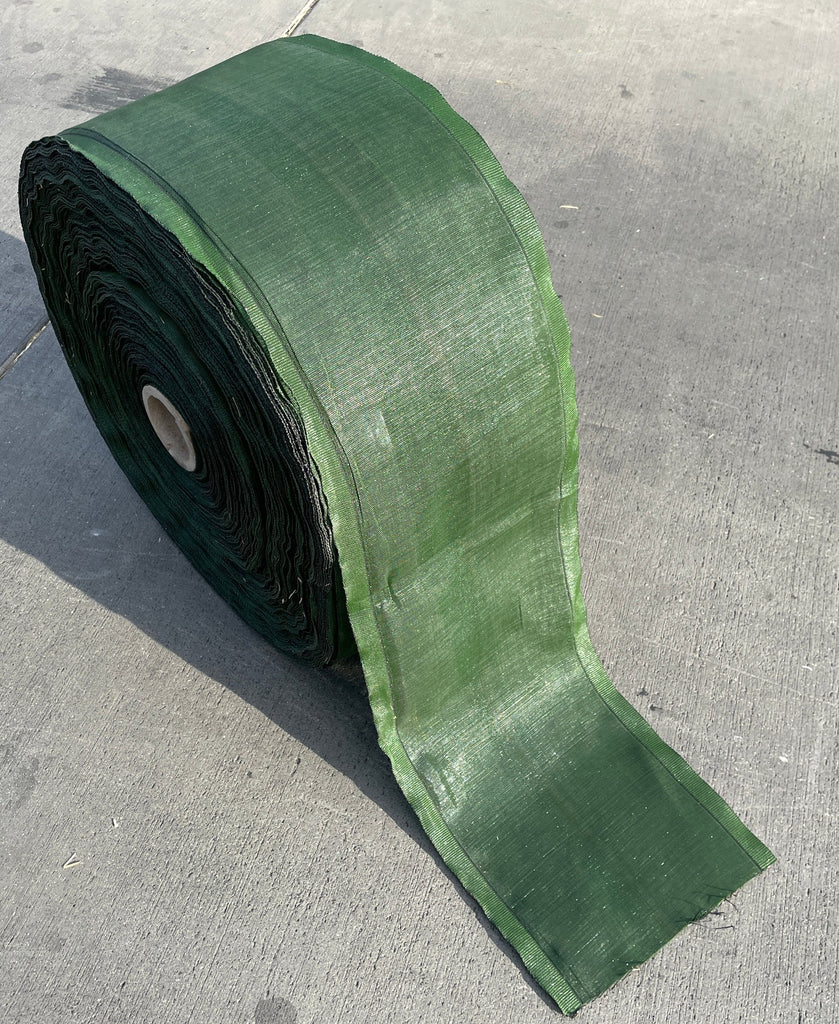 green tubular sandbag roll