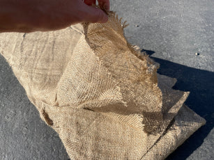 empty burlap biodegradable compost filter sock