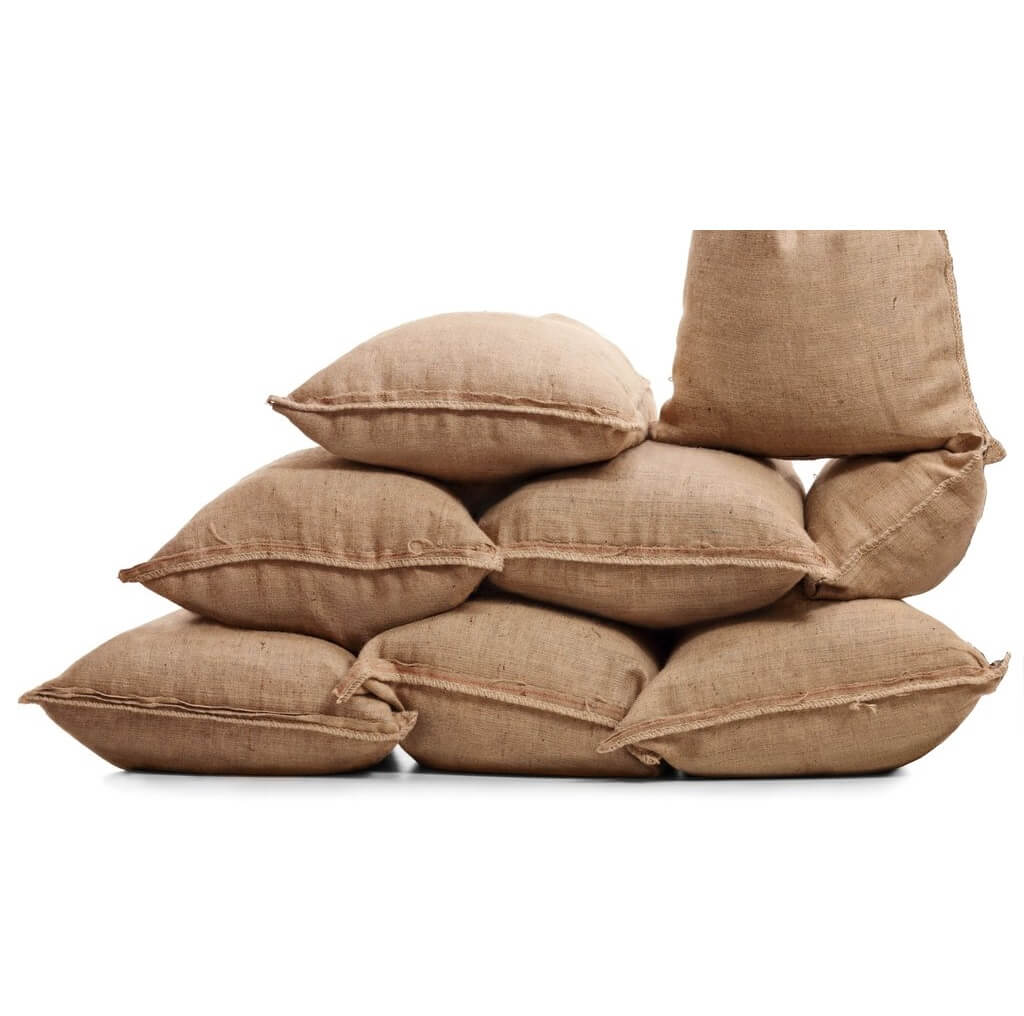 Filled burlap bags stacked on top of each other