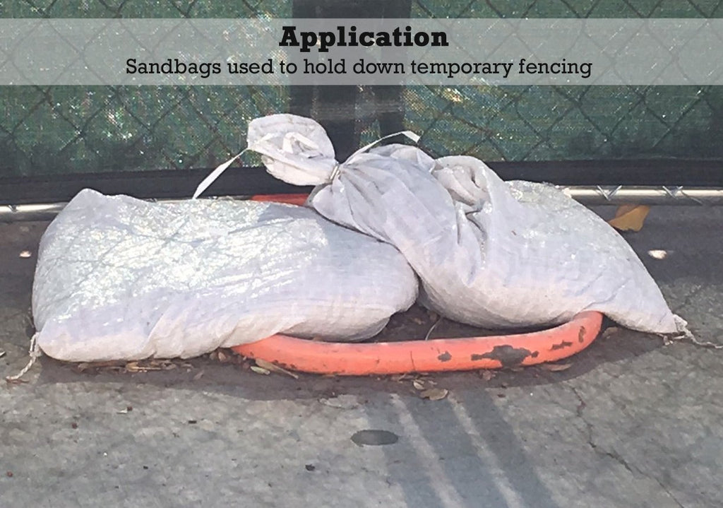 Sandbags used to hold down temporary fencing