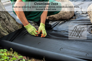 Extra thick 9-gauge garden staples securing weed barrier fabrics and erosion control mats.