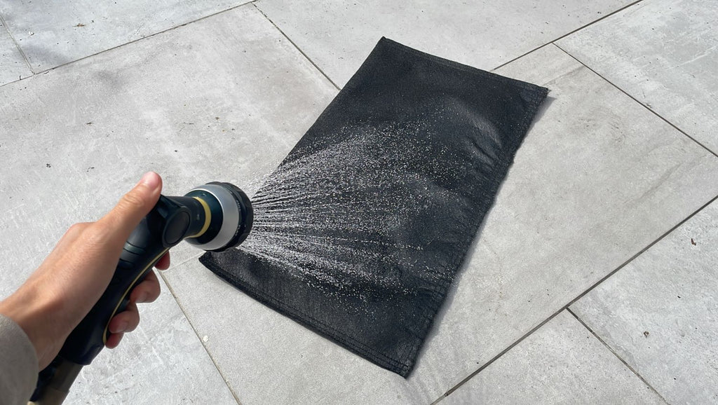 spray water activated sandbags to expand