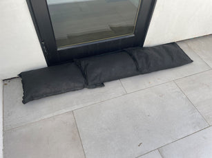 water activated sandbags in front of door to prevent flooding